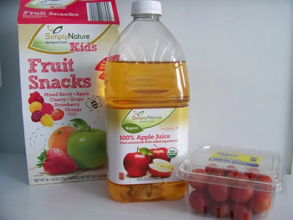 Aldi organic fruit snacks, apple juice, and tomatoes