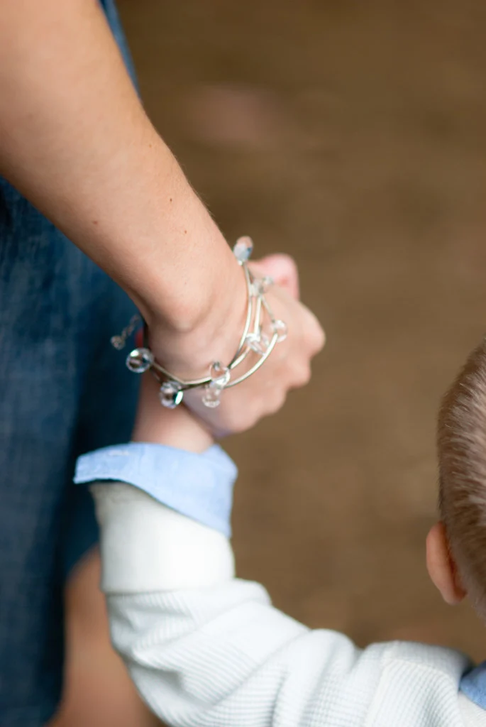 me, holding my son's hand
