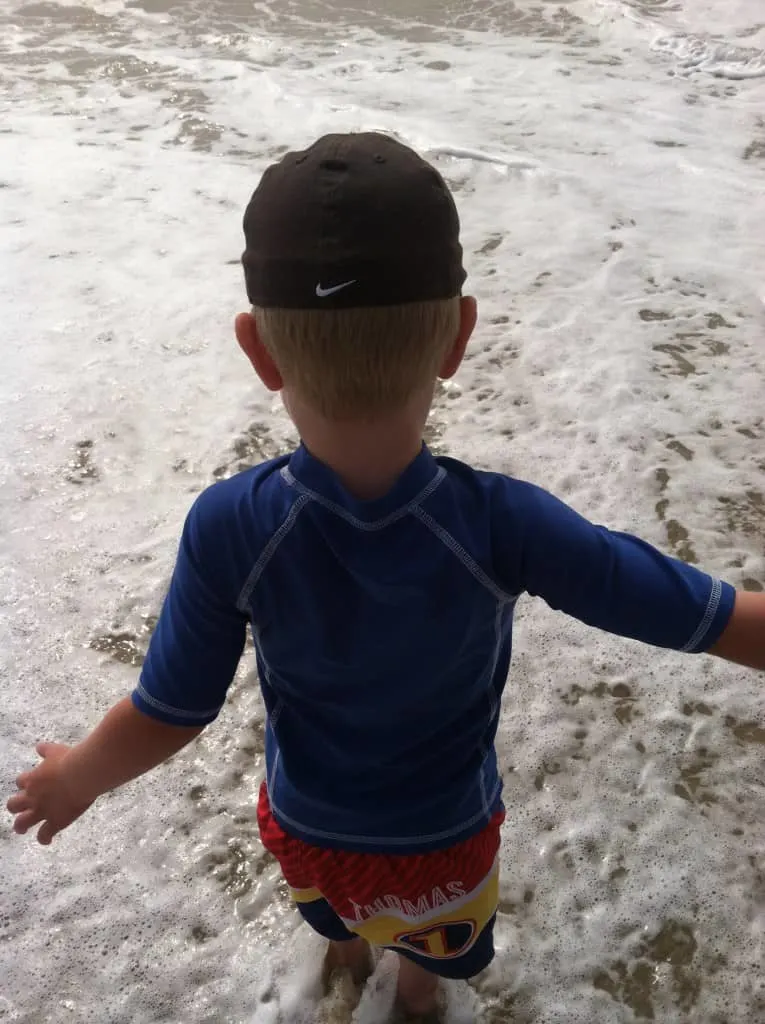 my son stepping into the ocean