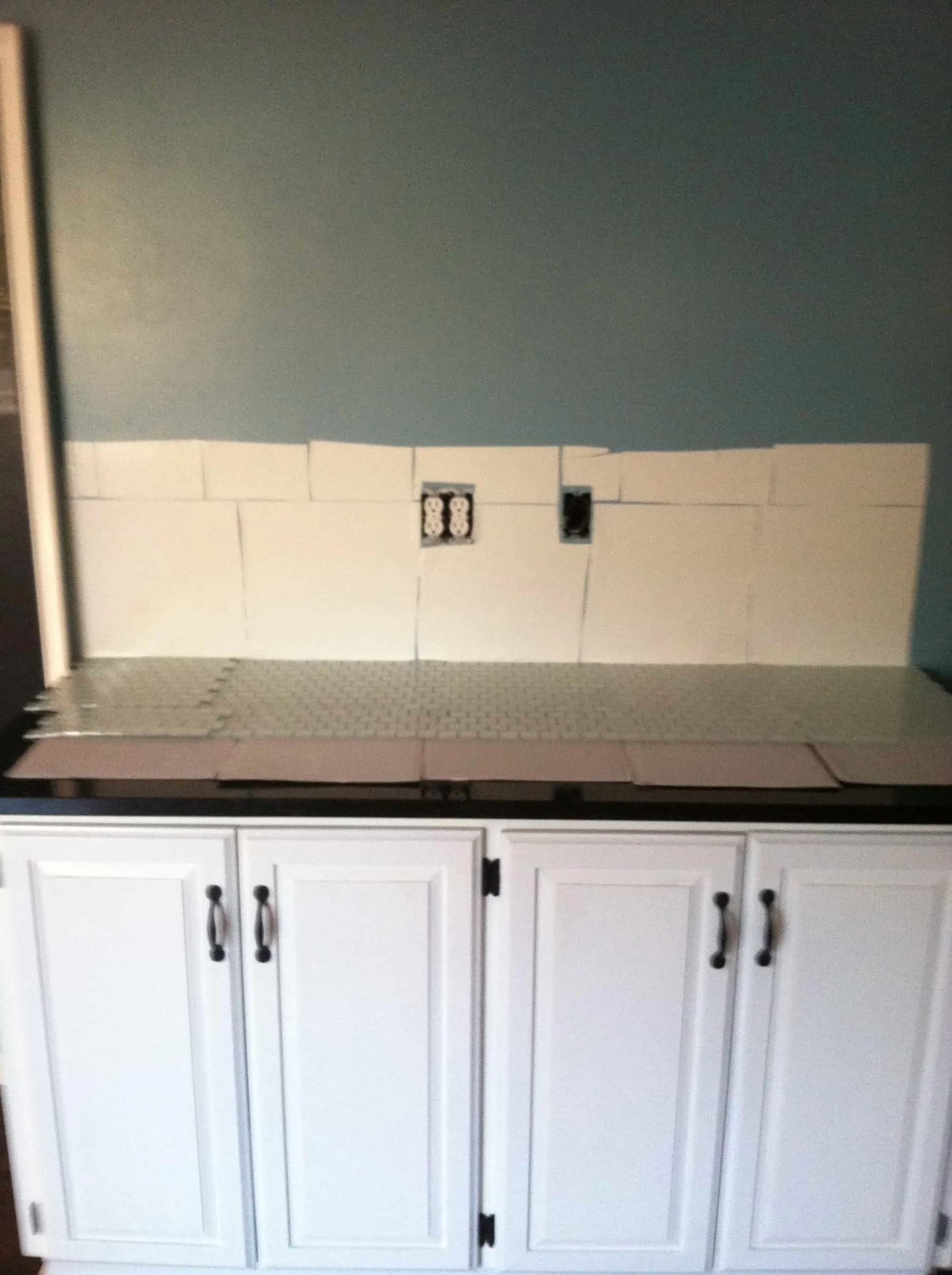 Musselbound Tile Mat Review- sheets of musselbound tile mat applied to the wall