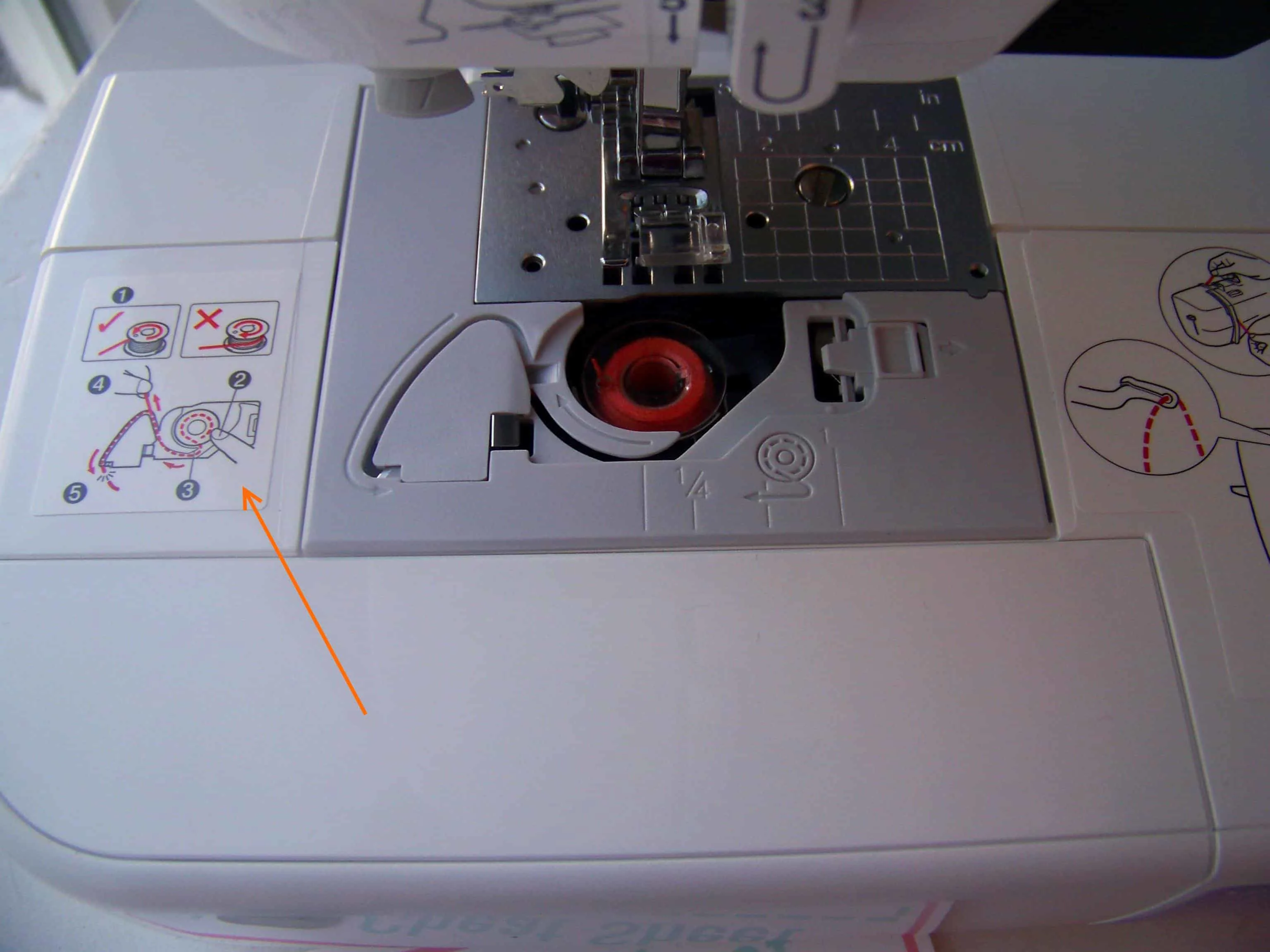 the bobbin thread guide sticker on the machine