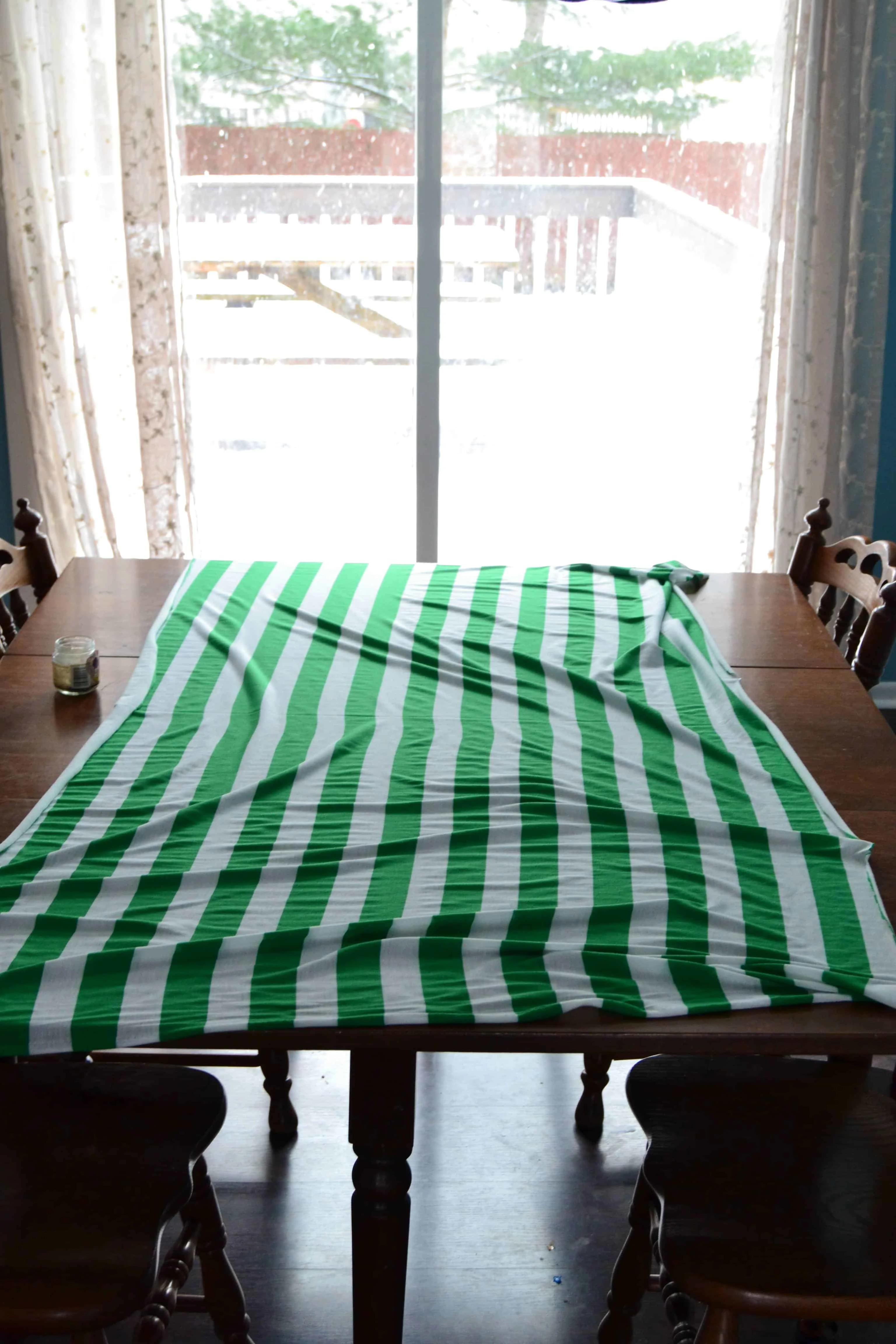 1 yard of striped knit fabric laid out on a table