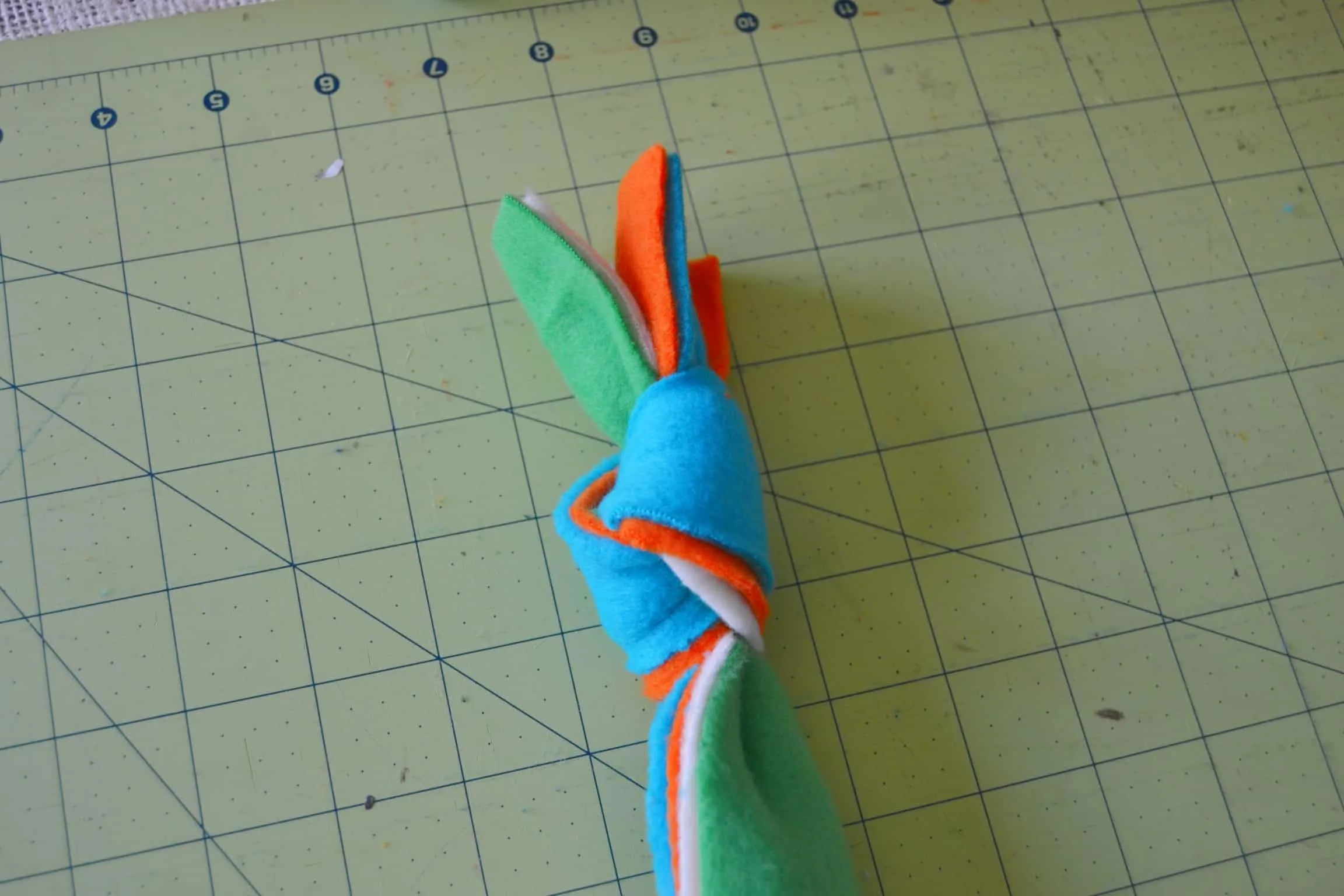 4 strips of fleece knotted at the end