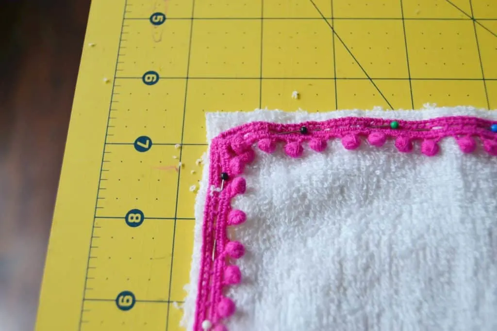 how to pin the pom pom trim in the corner