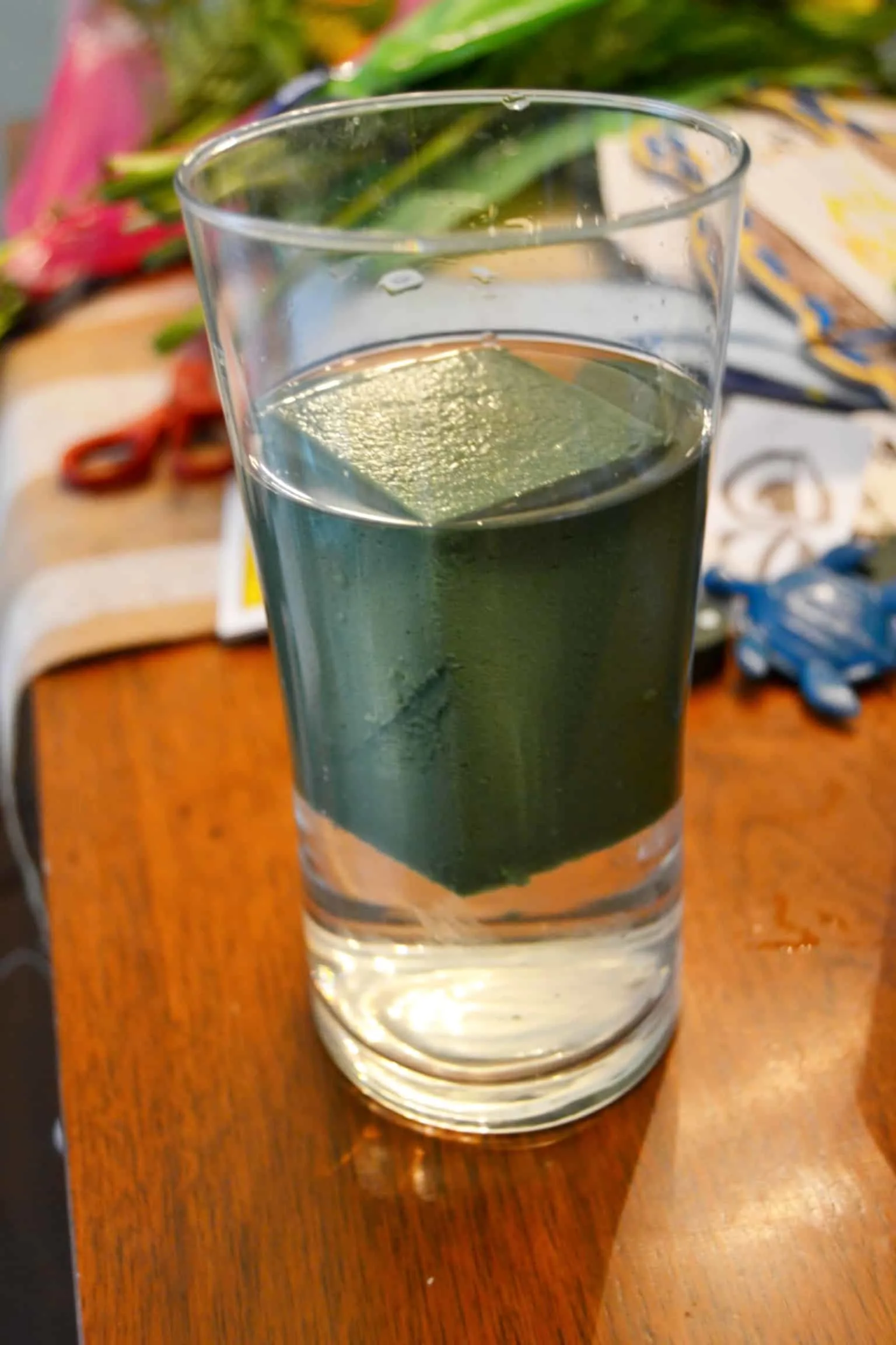 floral foam in water in a glass