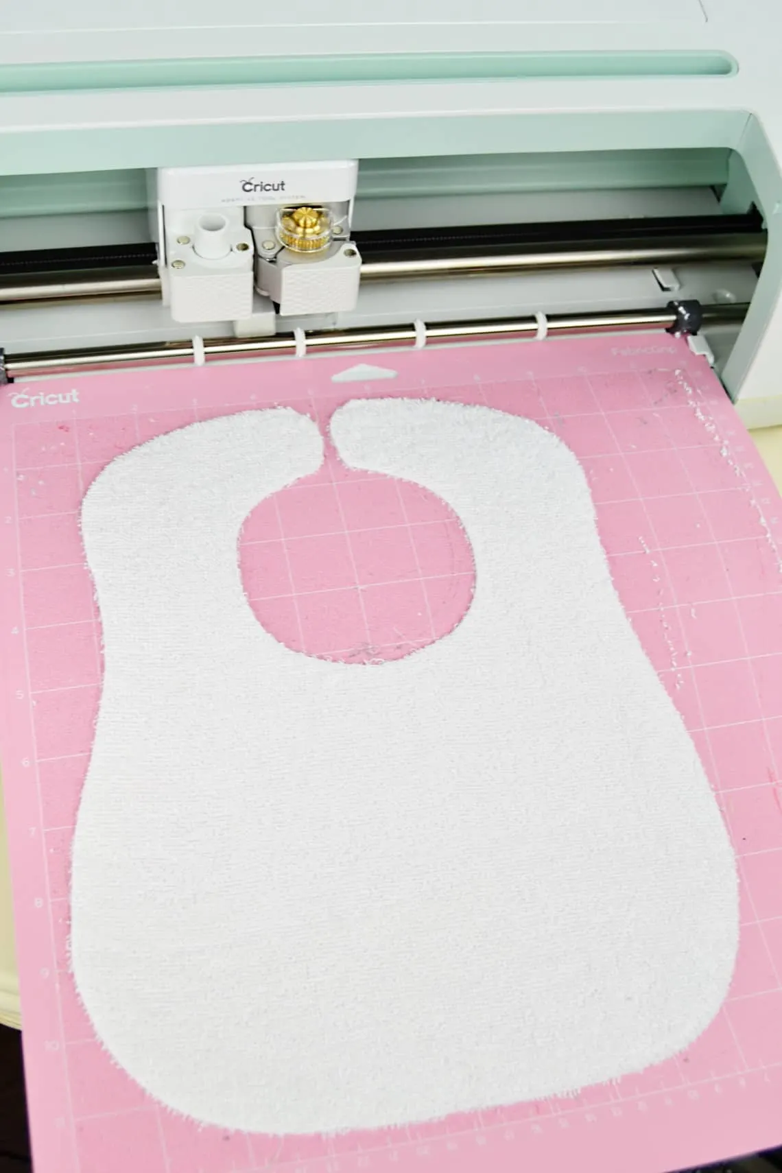 The terrycloth cut out into the shape of the bib pattern