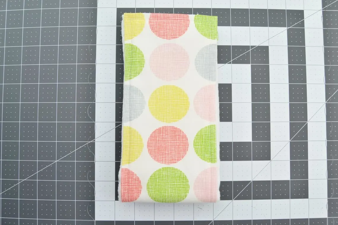 the burp cloth then folded in half