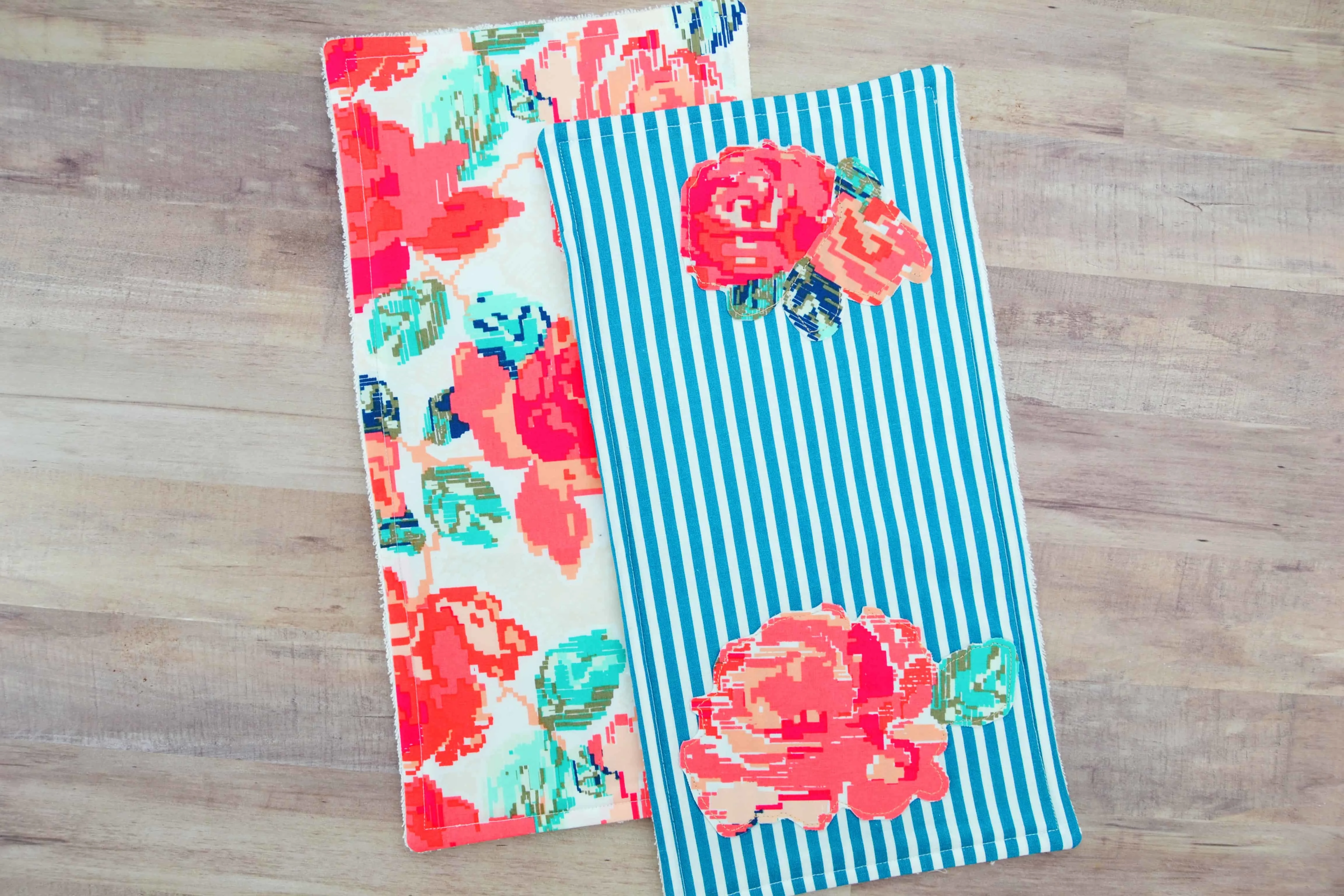 Two completed burp cloths sewn following this tutorial for how to sew burp cloths with appliques.