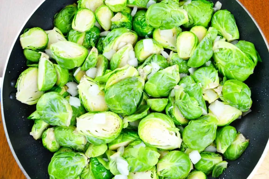the Brussels sprouts and onions in the pan