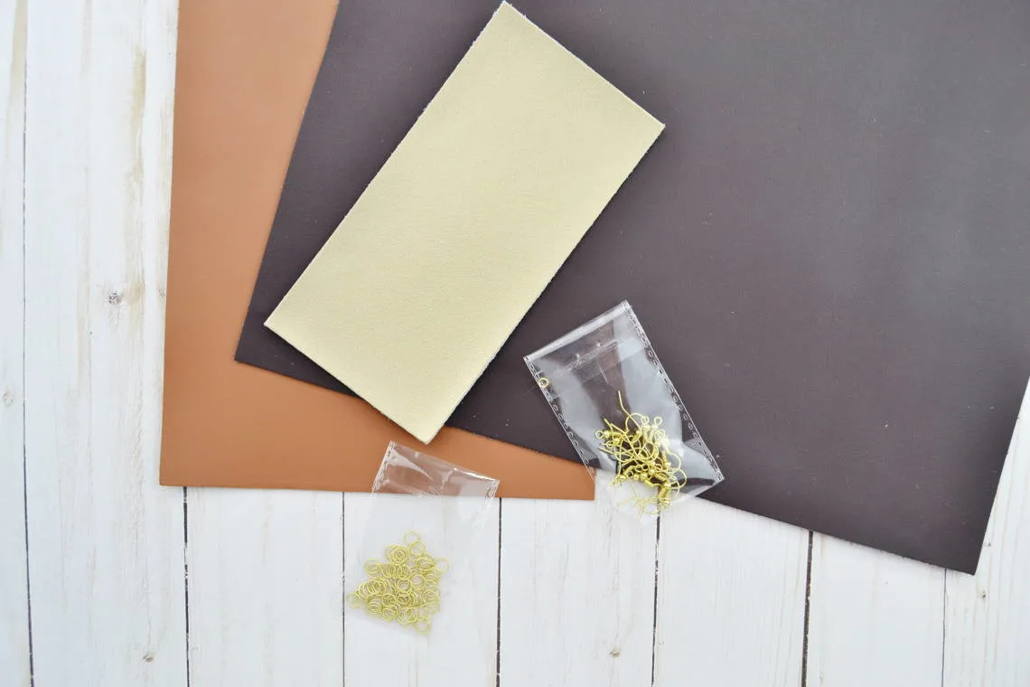 supplies to make earrings sitting on table