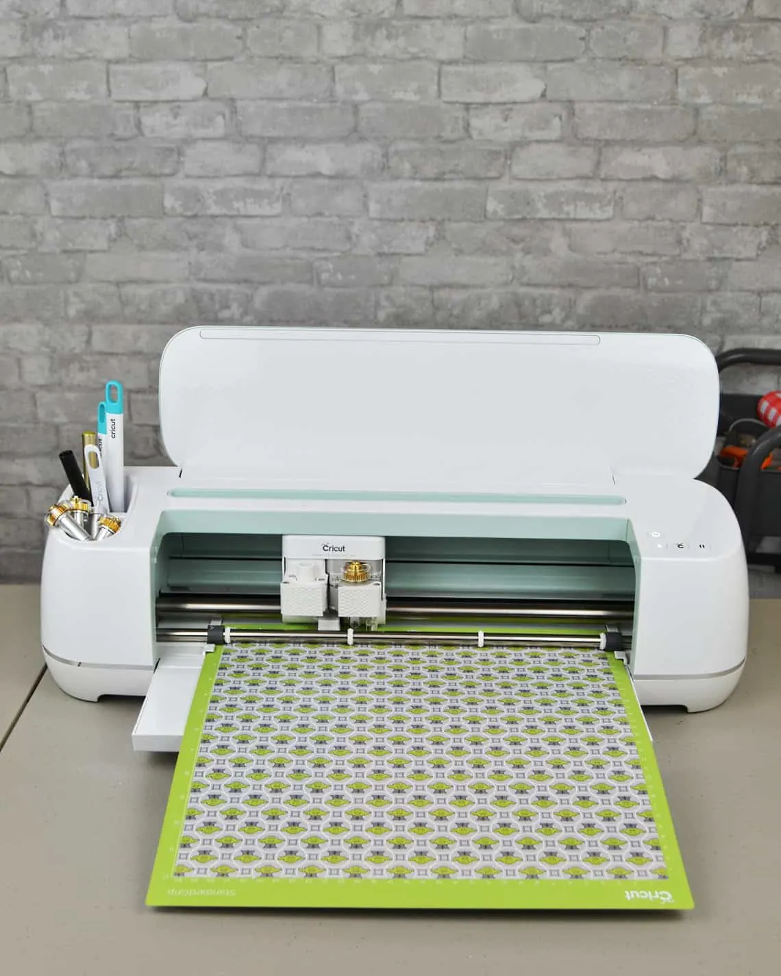 Cricut Maker with vinyl loaded onto mat