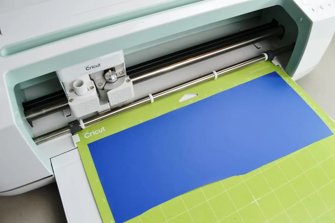 Iron-on vinyl loaded onto the cutting mat with the shiny side down
