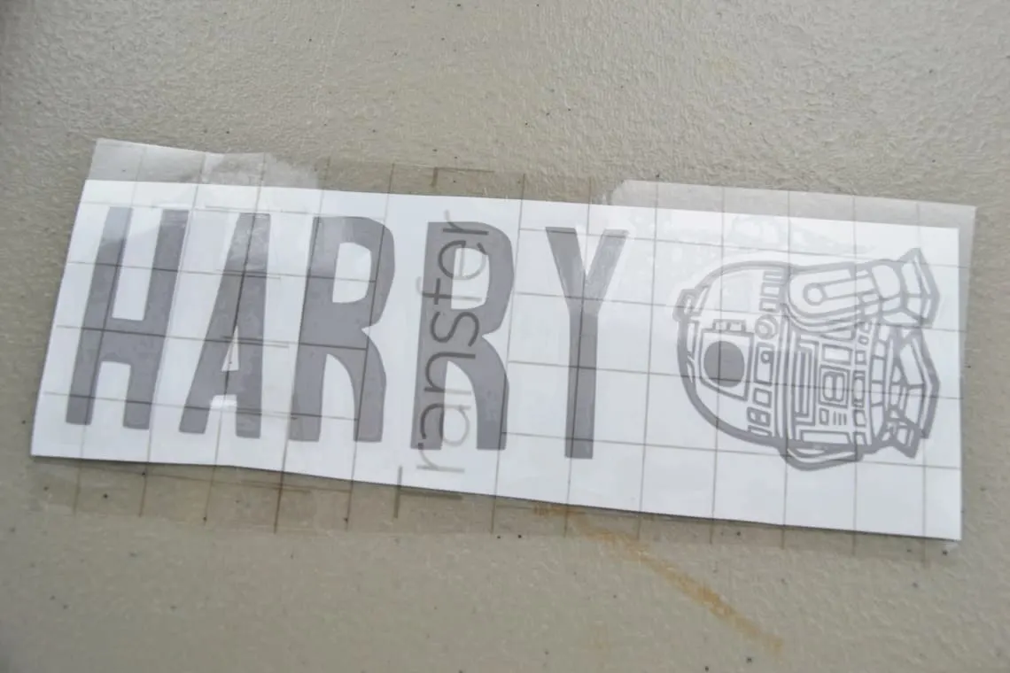 the transfer tape pressed onto the vinyl