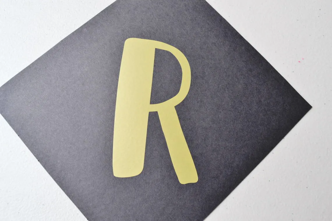 vinyl letter r on the paper for the banner
