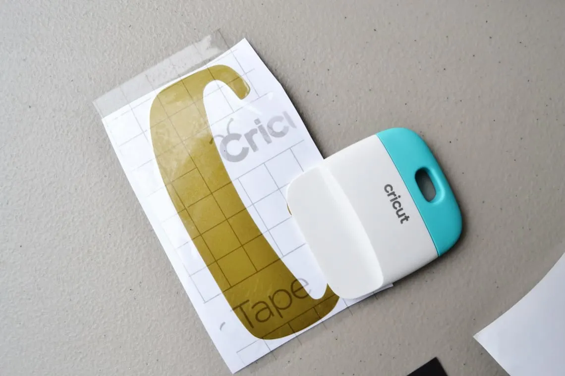 using transfer tape to apply vinyl to paper