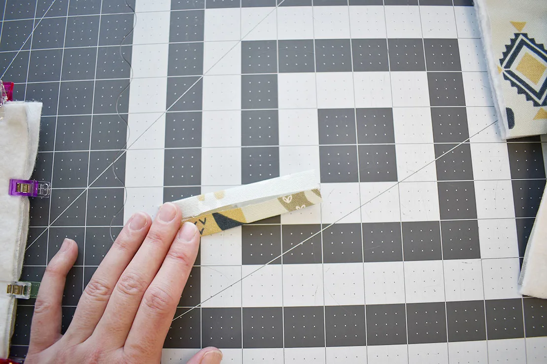 folding the piece of fabric to make the loop