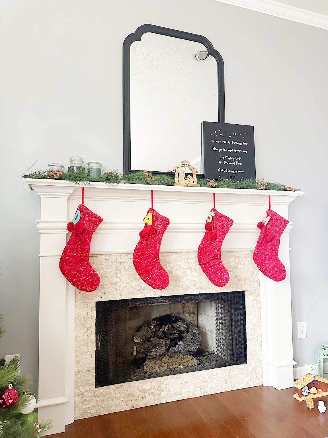 diy stocking tags on red stockings on mantle