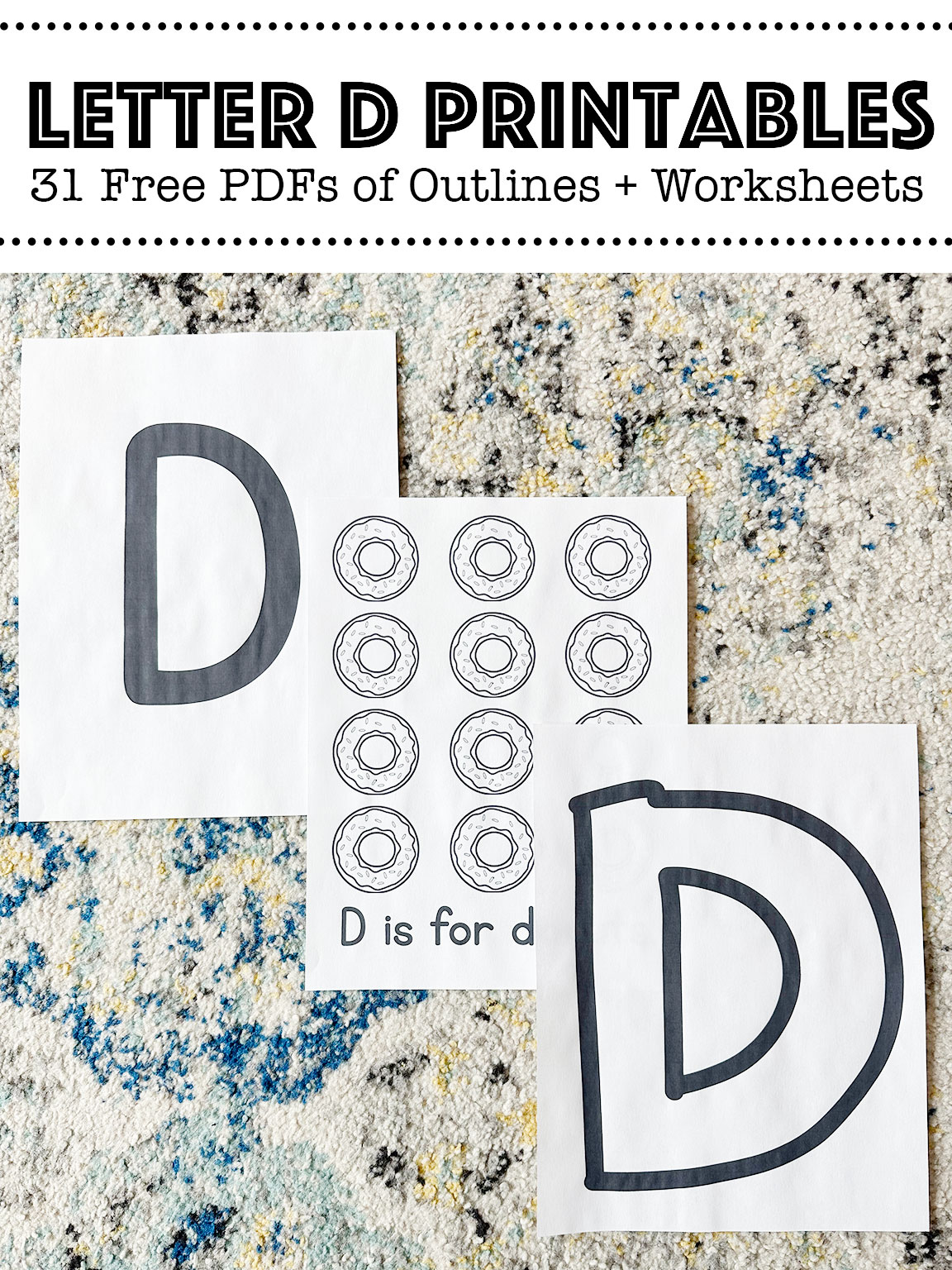 Letter D printable worksheets laid out on a rug
