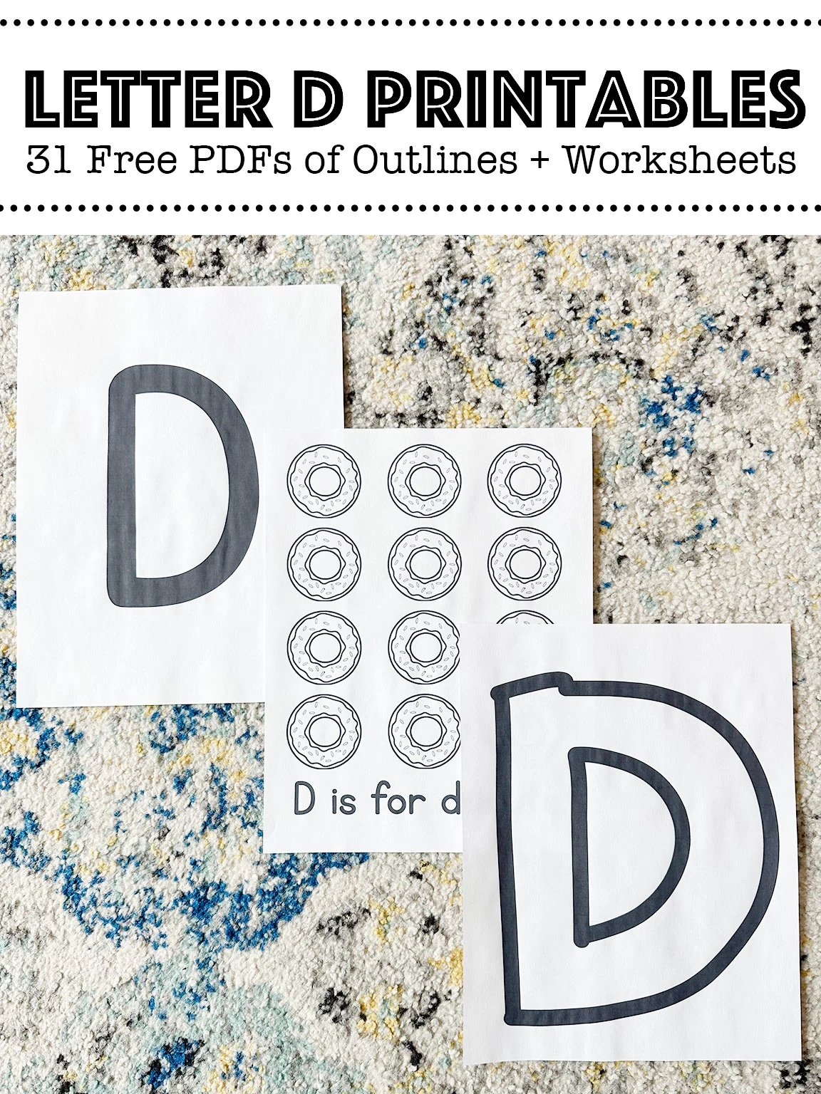 Letter D printable worksheets laid out on a rug