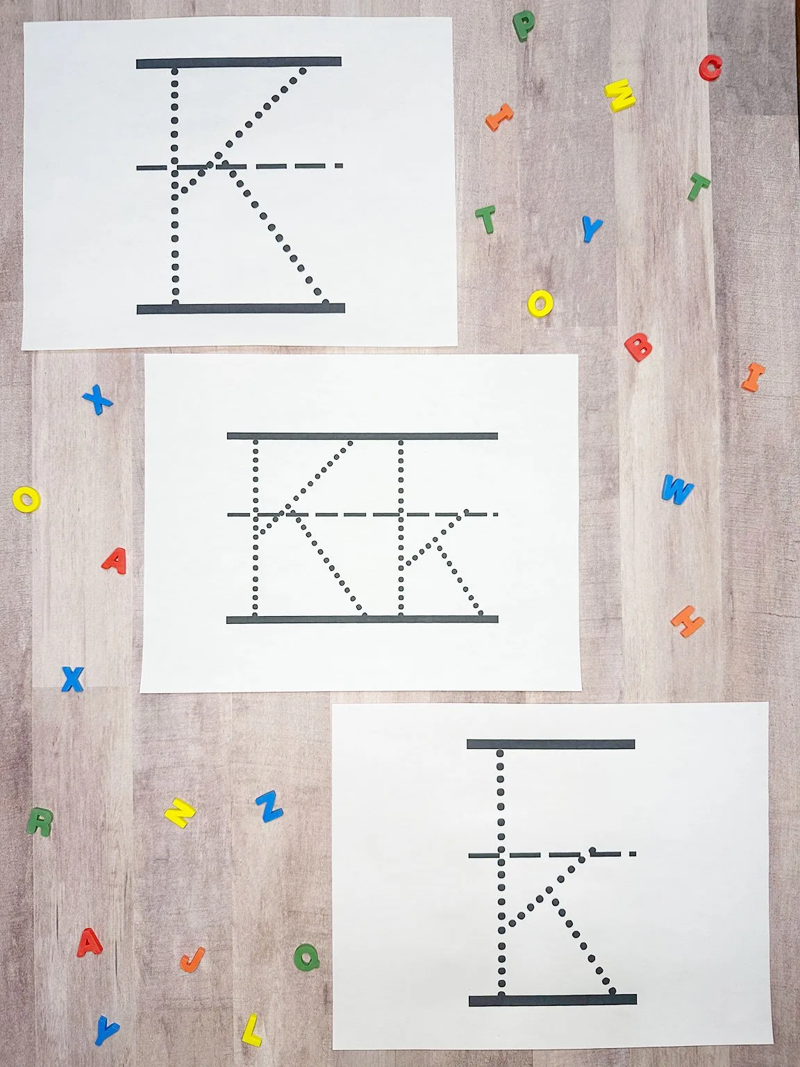 dotted letter k worksheets on a table