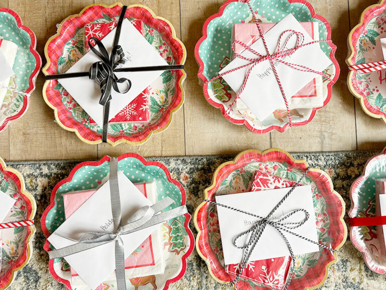 Neighbor Christmas gifts of paper plates and napkins packaged up with ribbon