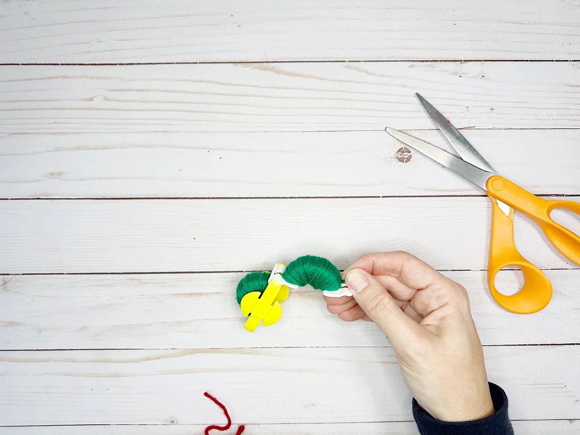 Yarn wrapped around the second side of the Pom Pom maker