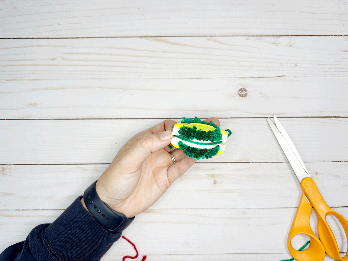 Inserting the yarn piece into the groove