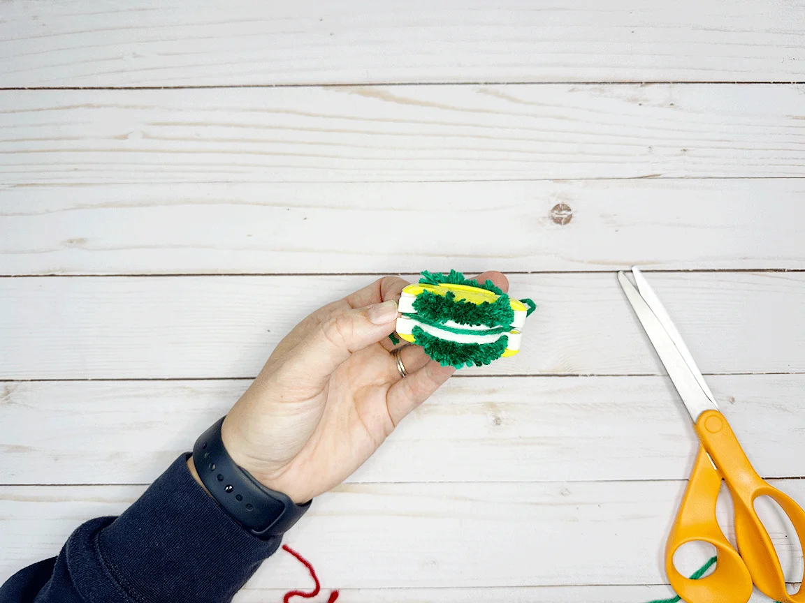 Inserting the yarn piece into the groove