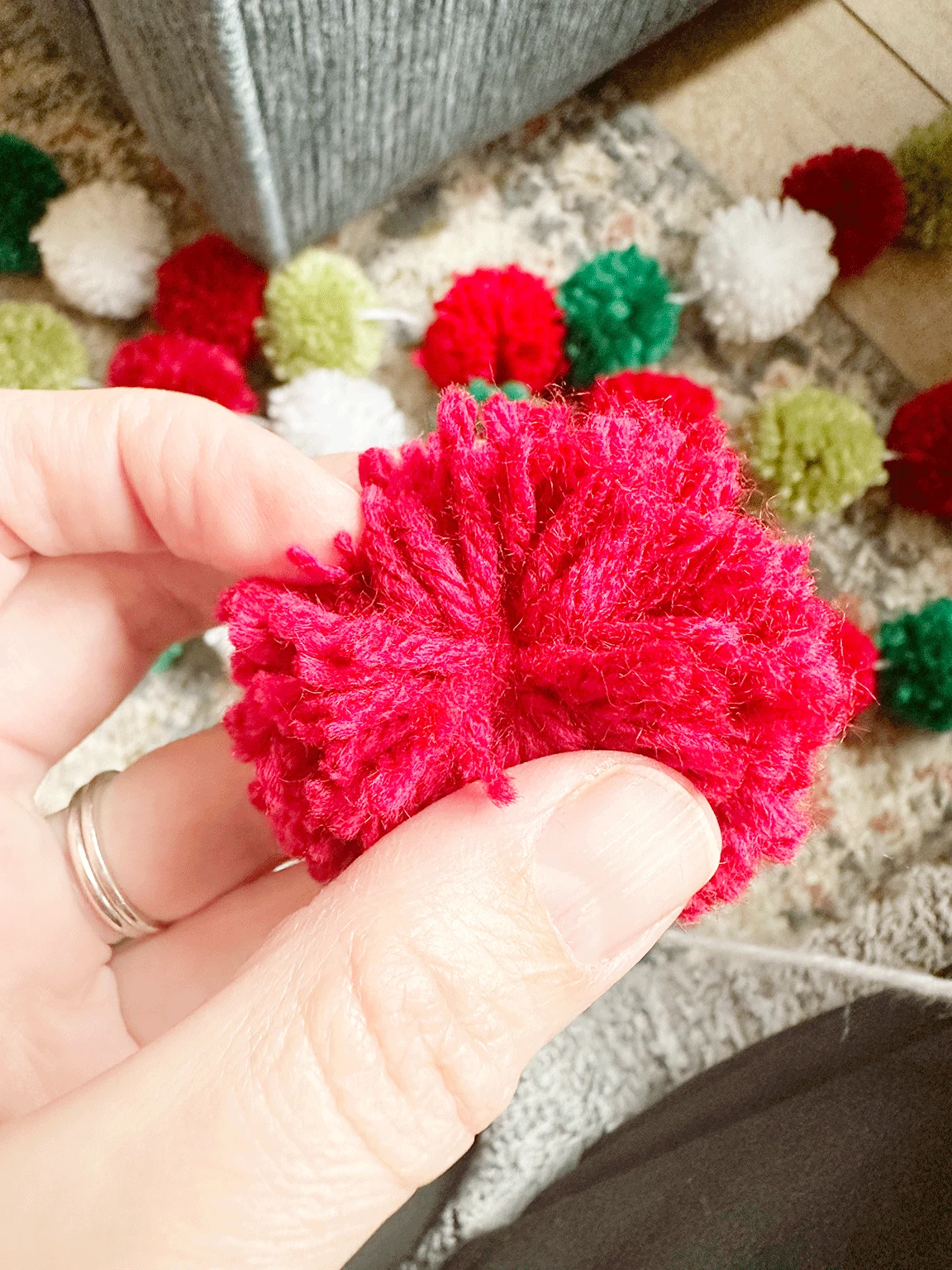 the yarn used to tie the Pom Pom at the center