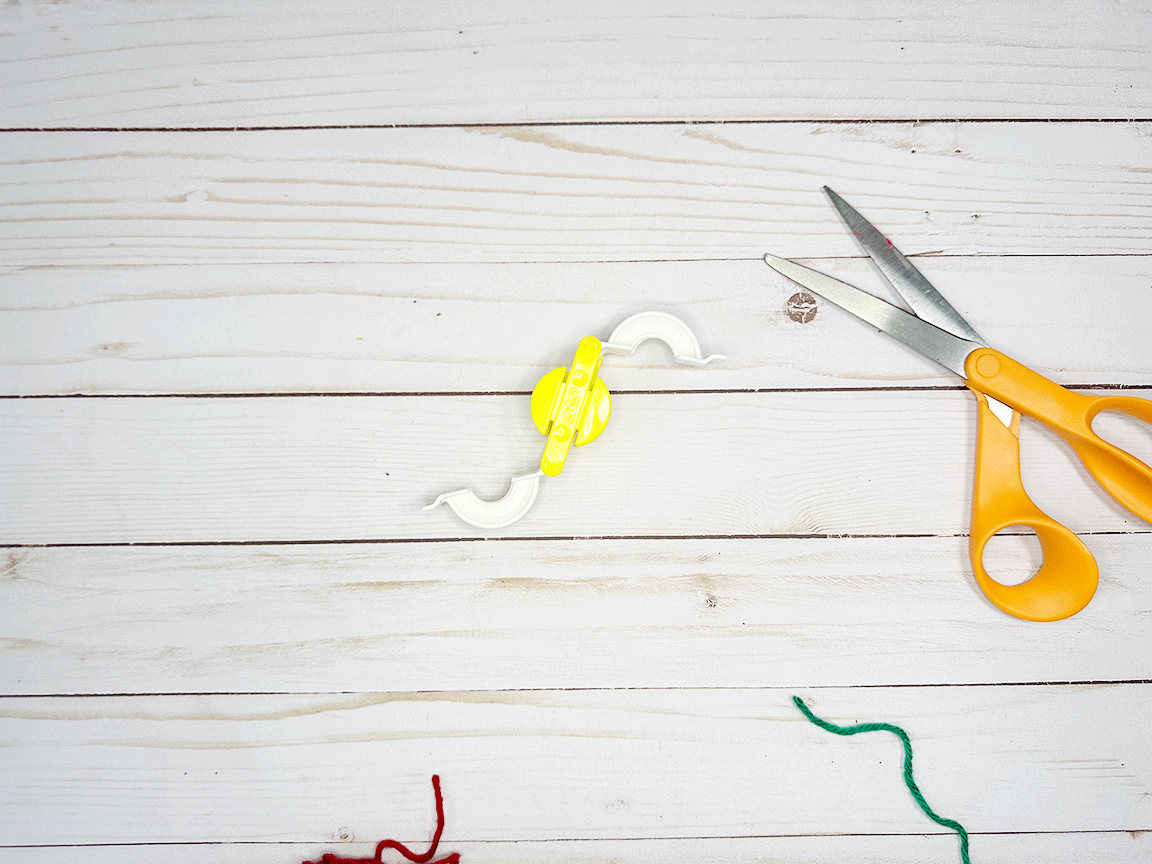 Pom Pom Maker Tool opened up to look like an S