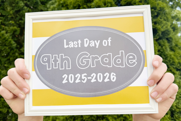 sign held by hands of free printable last day of school signs 2026